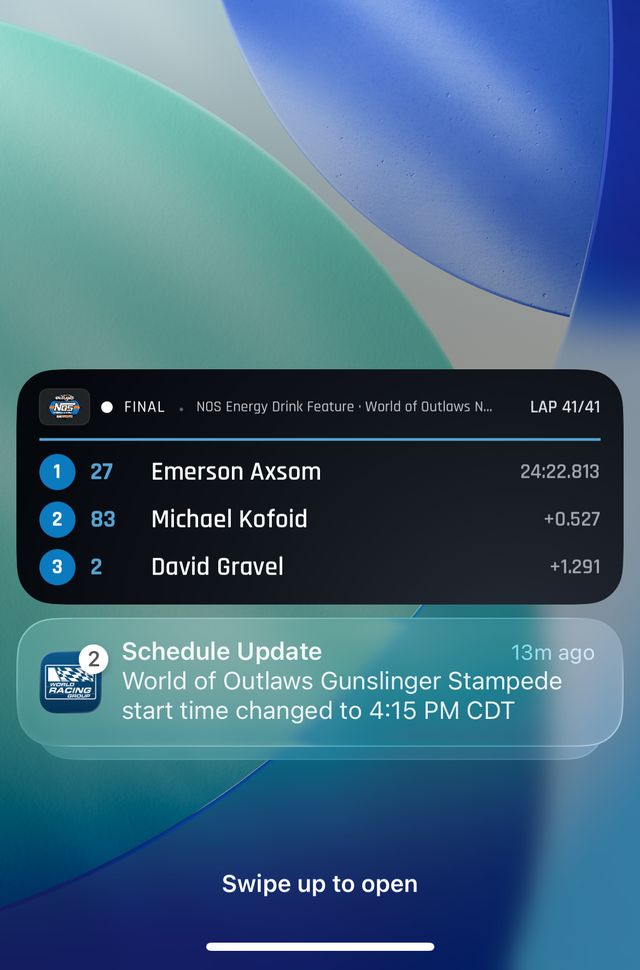 iPhone lock screen showing a World of Outlaws Live Activity with the top three and a schedule update notification